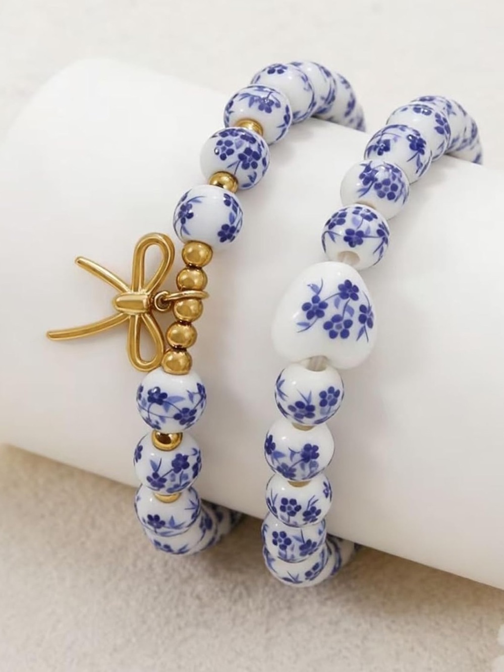 Anthropologie White and Blue Porcelain Bead Bracelet with Gold Bow